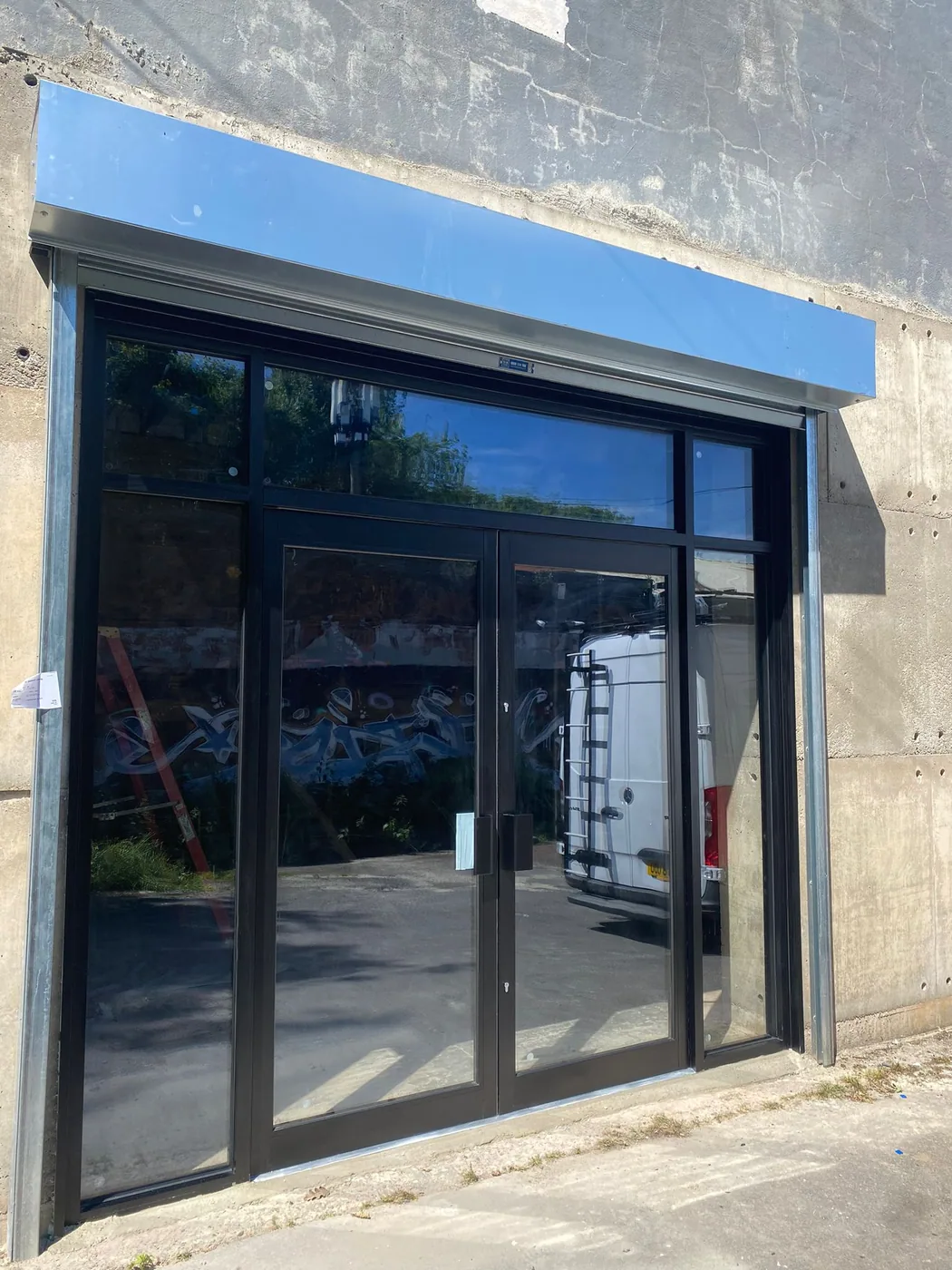 Completed commercial shopfront installation by Shopfront Shutters